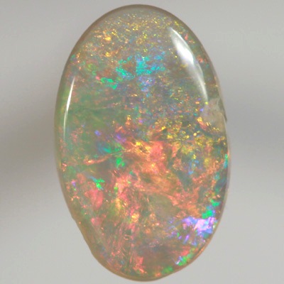 SOLID SEMI BLACK OPAL Bright, sparkly red and orange over green and blue
